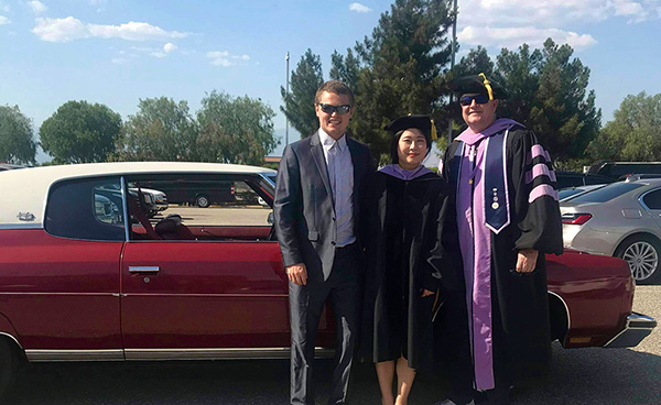 Dr. JinHee Choi with her husband and Dr. Mitchell