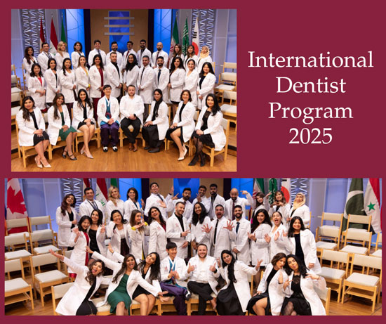 International Dentist Program Class of 2025 students pose together on stage during a dedication ceremony, wearing white coats for a formal group photo