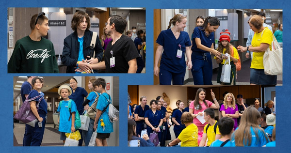 Dental students interact with children and families during a community visit inside the Loma Linda University School of Dentistry building