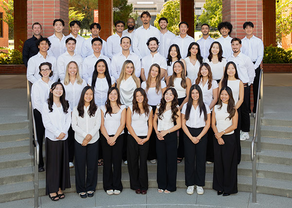 The 2026–2027 ASDA Committee posed in white shirts on outdoor campus steps.