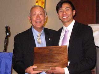 Dr. Terry Tanaka congratulates Michael Siy