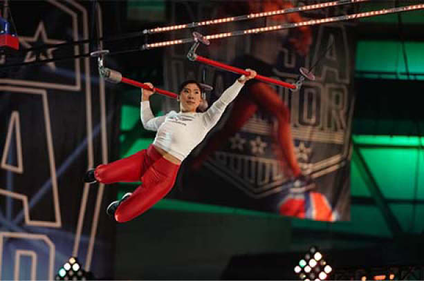 Sarah Chang swings from obstacle course bars