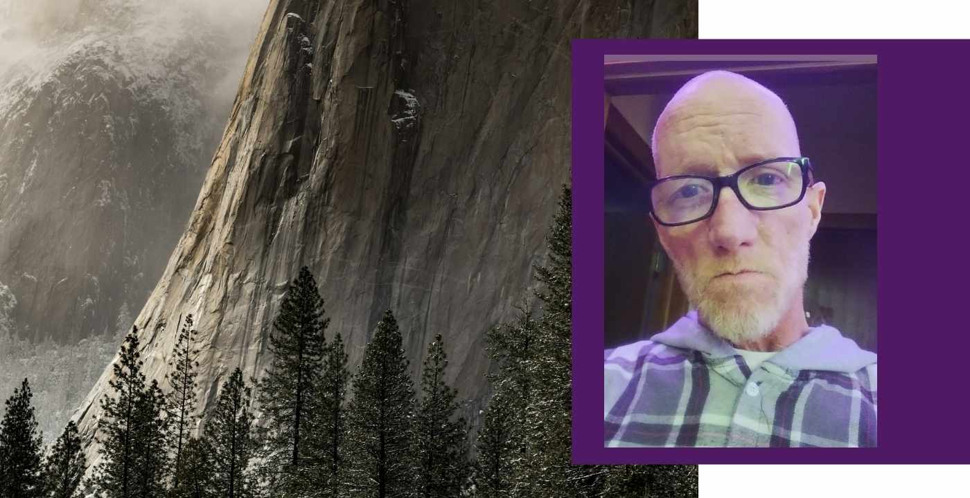 Website banner featuring a mountain landscape alongside a portrait photo of David framed in purple.