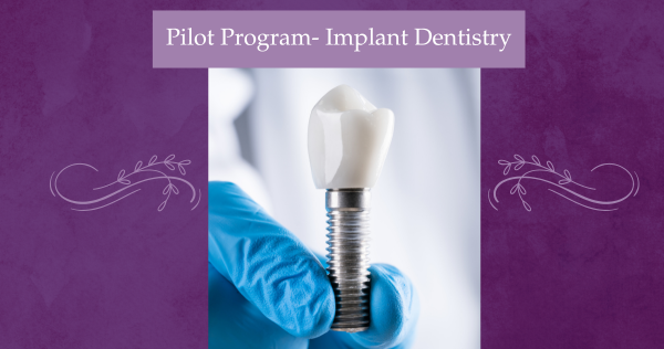 photo of a gloved hand holding an implant