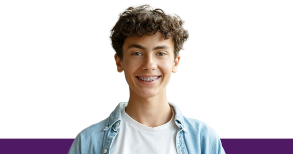 Young person wearing braces, photographed against a white background for an orthodontic dental care feature.