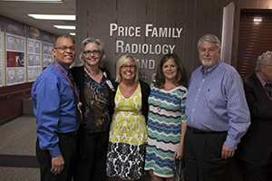 Naming Opportunities-  4 people in from of "Price Family Radiology and ..."