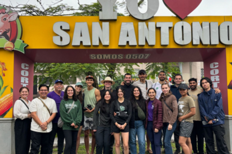 group photo near a sign that says I heart San Antonio