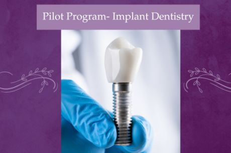 photo of a gloved hand holding an implant