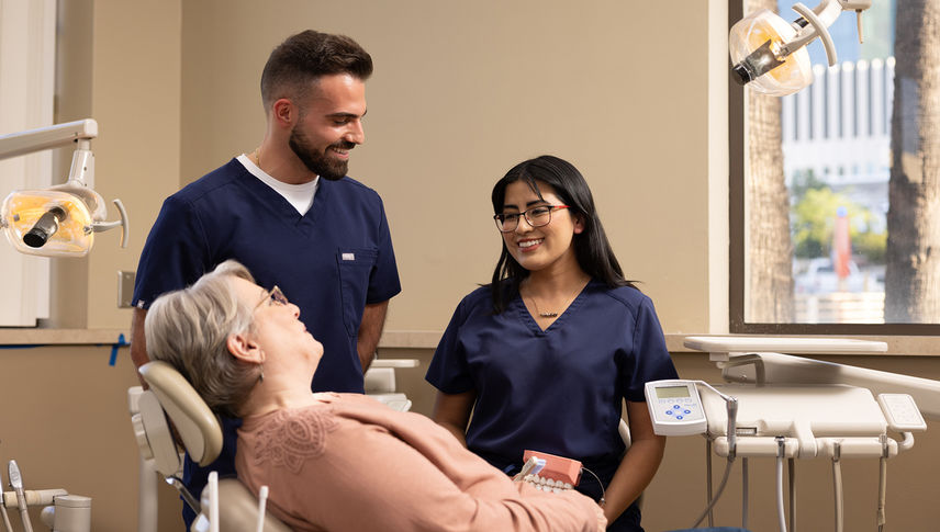 Nurses smiling at patient