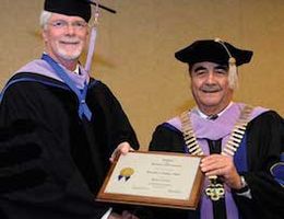 ADI President Ramon Baez congratulates Dr. Dailey on his Honorary Fellowship.