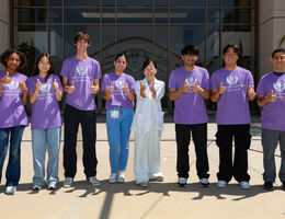 Students standing with Dr. So Ran Kwon at the end of the program