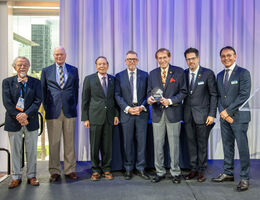 Award recipients pose on stage in Orlando.